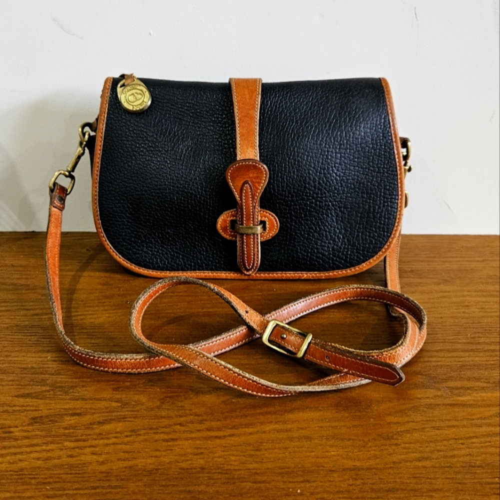 Vintage Dooney and bourke pretagged Black Pebbled Leather/Tan Crossbody bag